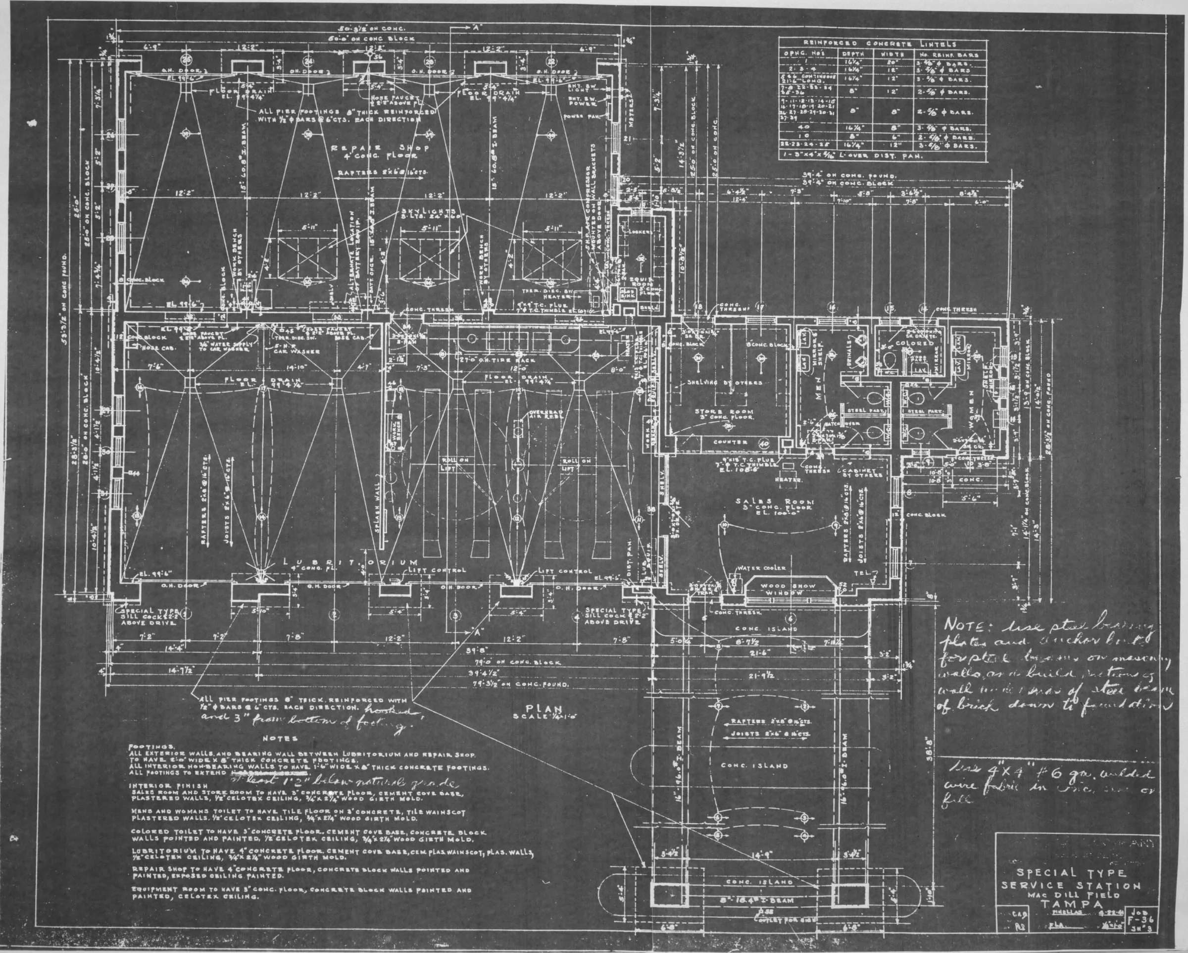 Plans and drawings spread across a work table