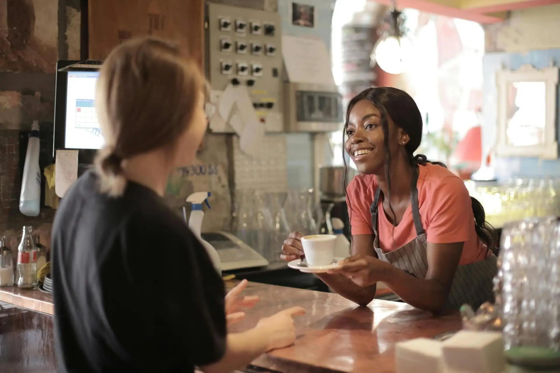 A small business owner serving a customer