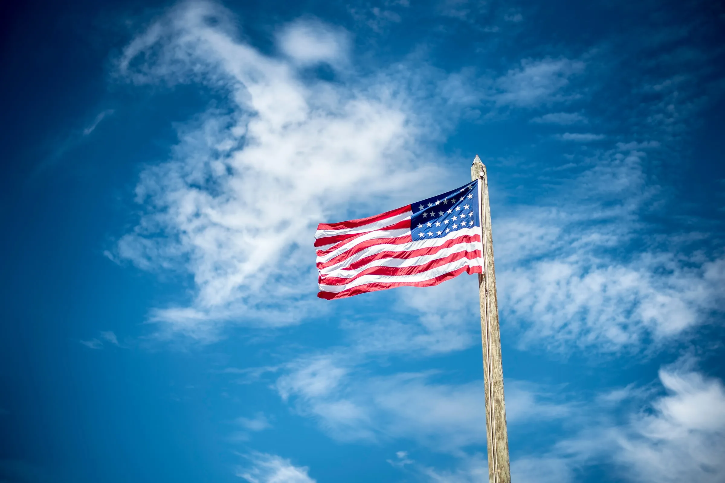 Silhouettes before the American flag